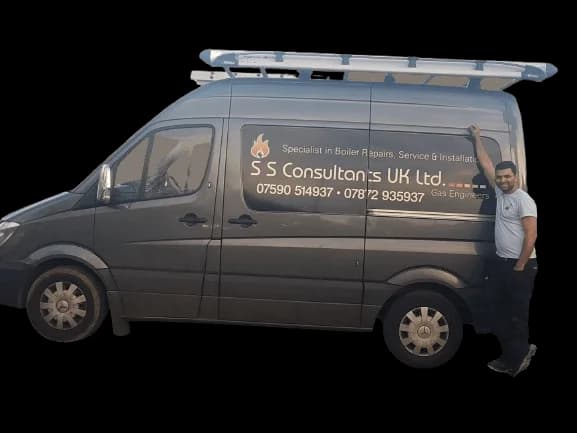 SS Consultants heating engineer beside a service van